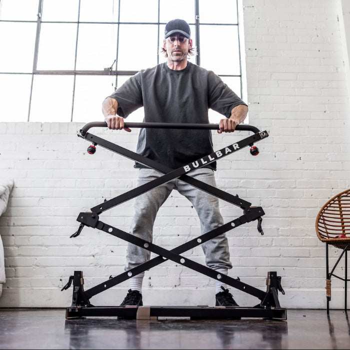 A BULLBAR standing set up on a bedroom floor, unfolded and ready to train