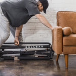 The folded BULLBAR slides under a couch for storage